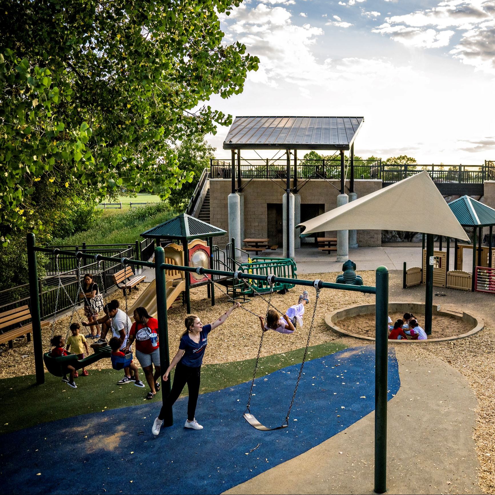 Kids playing on the swings at Westlands Park Playground