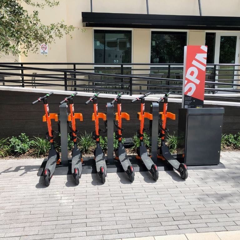 Spin electric scooter docking station